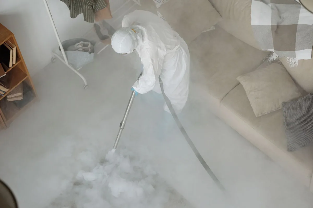 Biohazard cleanup technician in protective equipment, Vineyard, CA